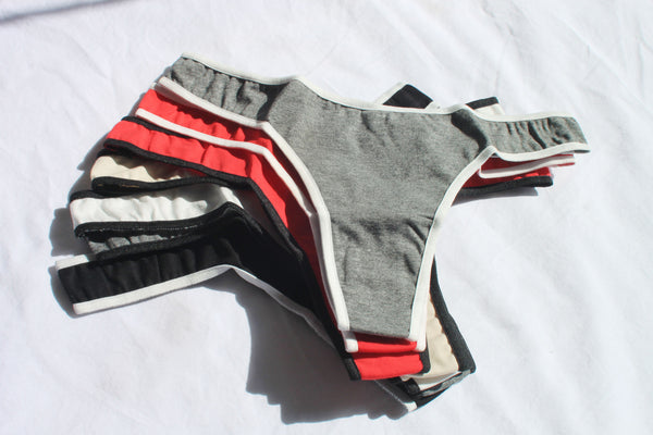 Super Sporty Contrast Trim Thong | All colors in fanned out pile.